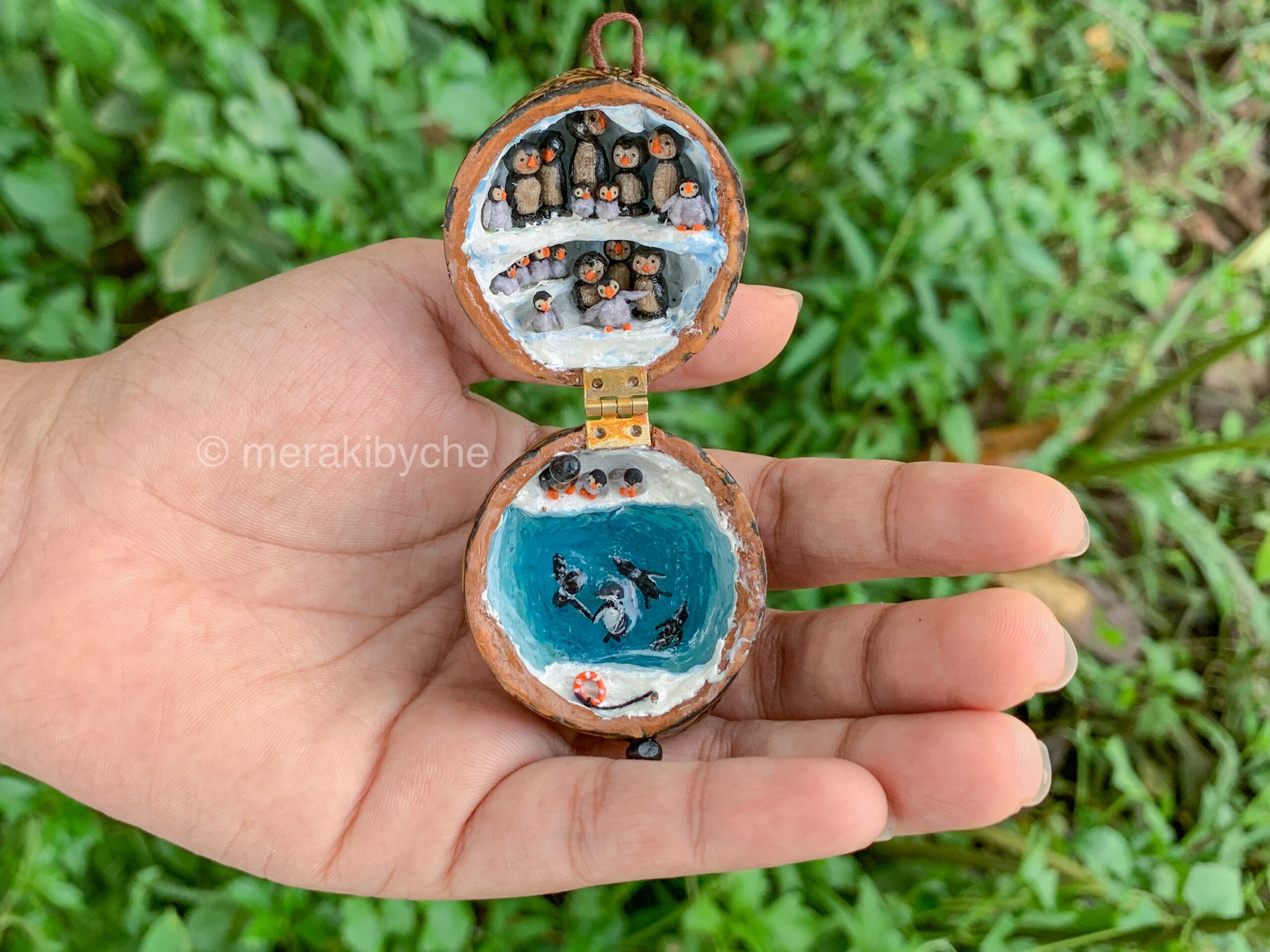 Miniature penguin Diorama in a walnut