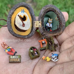 Miniature fairy wooden furnitures with wooden teddy bears in a walnut